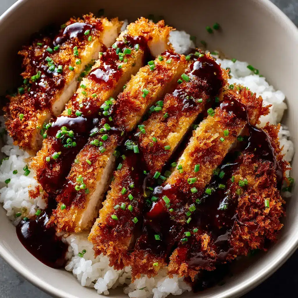 An extreme close-up of crispy chicken katsu, showing the flaky panko breadcrumb texture after being fried to a perfect golden brown.